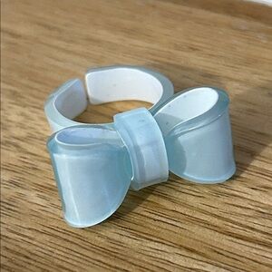 Acrylic Bow Ring NEW light blue whitish color size 7